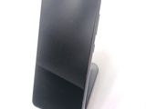 a cell phone that is sitting on top of a stand
