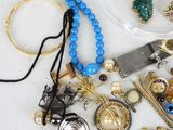 a lot of jewelry sitting on a table together