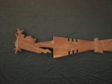 an image of a wooden model of a man and woman in a boat