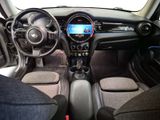 the interior of a small car with a steering wheel and dashboard