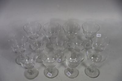 many empty wine glasses sitting on a white table