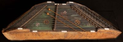 a very old musical instrument that is sitting on a table