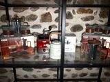 many different types of coffee pots on a shelf