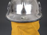 a close up of a fireman ' s helmet with a yellow bandanna around it