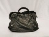 black leather handbag on a white background with a white background
