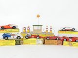 several toy cars are lined up on top of each other