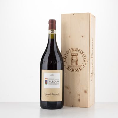 the bottle of red wine is next to a wooden box