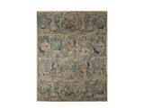 un tapis beige et bleu avec un motif