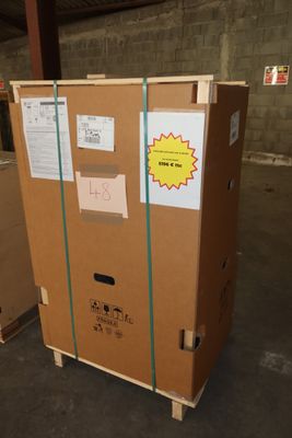 a cardboard box that is sitting on a pallet in a warehouse