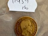 une pièce d'or sur laquelle figure le visage d'un homme