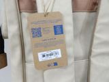 a bag with a tag on it hanging from a hanger