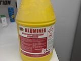 a close up of a gallon of yellow liquid on a counter