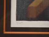 painting of a banana in a wooden frame with a black background
