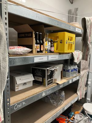 a shelf with many items on it in a room