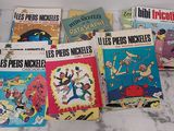 several children ' s books are lined up on a marble surface