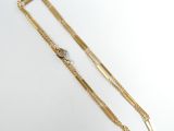 a gold bracelet with a chain and a clasp on it