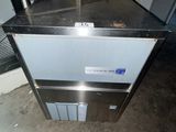 an image of a kitchen with a refrigerator and a counter top