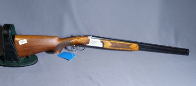 a shotgun that is sitting on top of a table