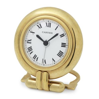 an image of a gold clock with roman numerals on the face