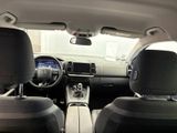 the interior of a car with a steering wheel and a dashboard