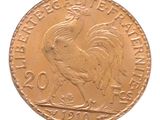 l'image d'une pièce d'or ornée d'un coq