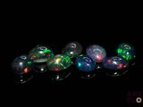 a close up of a group of oplites on a black background