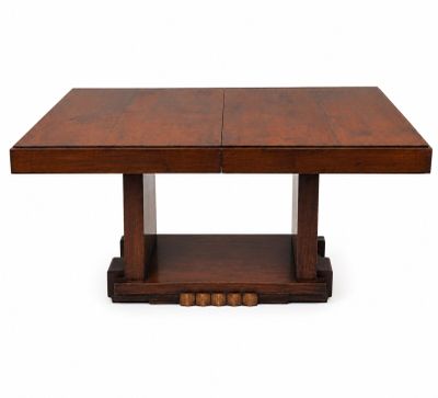 a wooden table with two square legs and a square top
