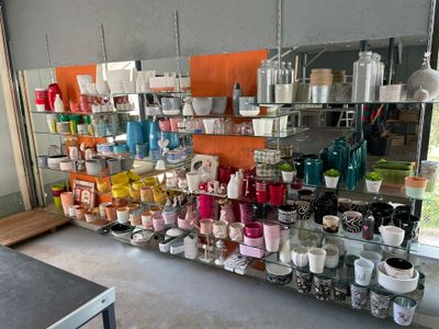 a shelf with many different items on it in a room