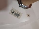 a close up of a toilet with a sticker on it