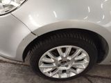 a close up of a white car with black rims