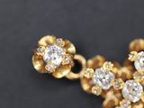 a close up of a cross made out of gold and diamonds