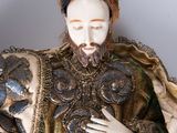 a figurine of a man with a beard and a beard