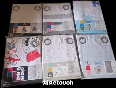 many t - shirts laid out on a black surface