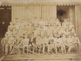 an old photo of a baseball team posing for a picture