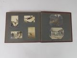 an old photo of a book with pictures of people on it