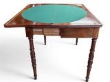 a small table with a green cloth on it