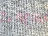 a close up of a piece of fabric with writing on it