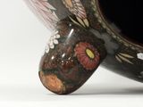 a large vase with a flower design on it