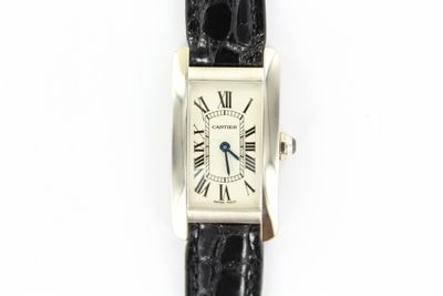a close up of a wrist watch with roman numerals on it