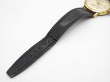 an image of a wrist watch with a black leather band