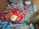 a cardboard box full of water bottles and snacks