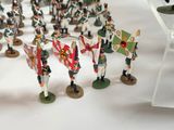 many figurines of soldiers that are standing in a circle