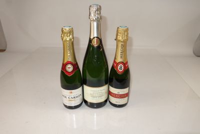 three bottles of champagne sitting on a counter top next to each other