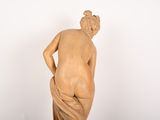 statue of a woman with her back turned to the side