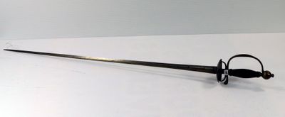 a sword that is laying on a white surface