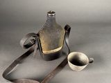a picture of a bottle and a spoon on a table