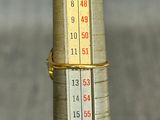 a thermometer on a pole that is on the ground