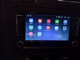 an image of a car dashboard with a display of apps on the screen