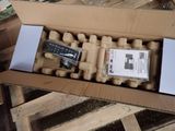 a cardboard box with a remote control inside of it