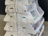 a large stack of newspapers sitting on a pallet